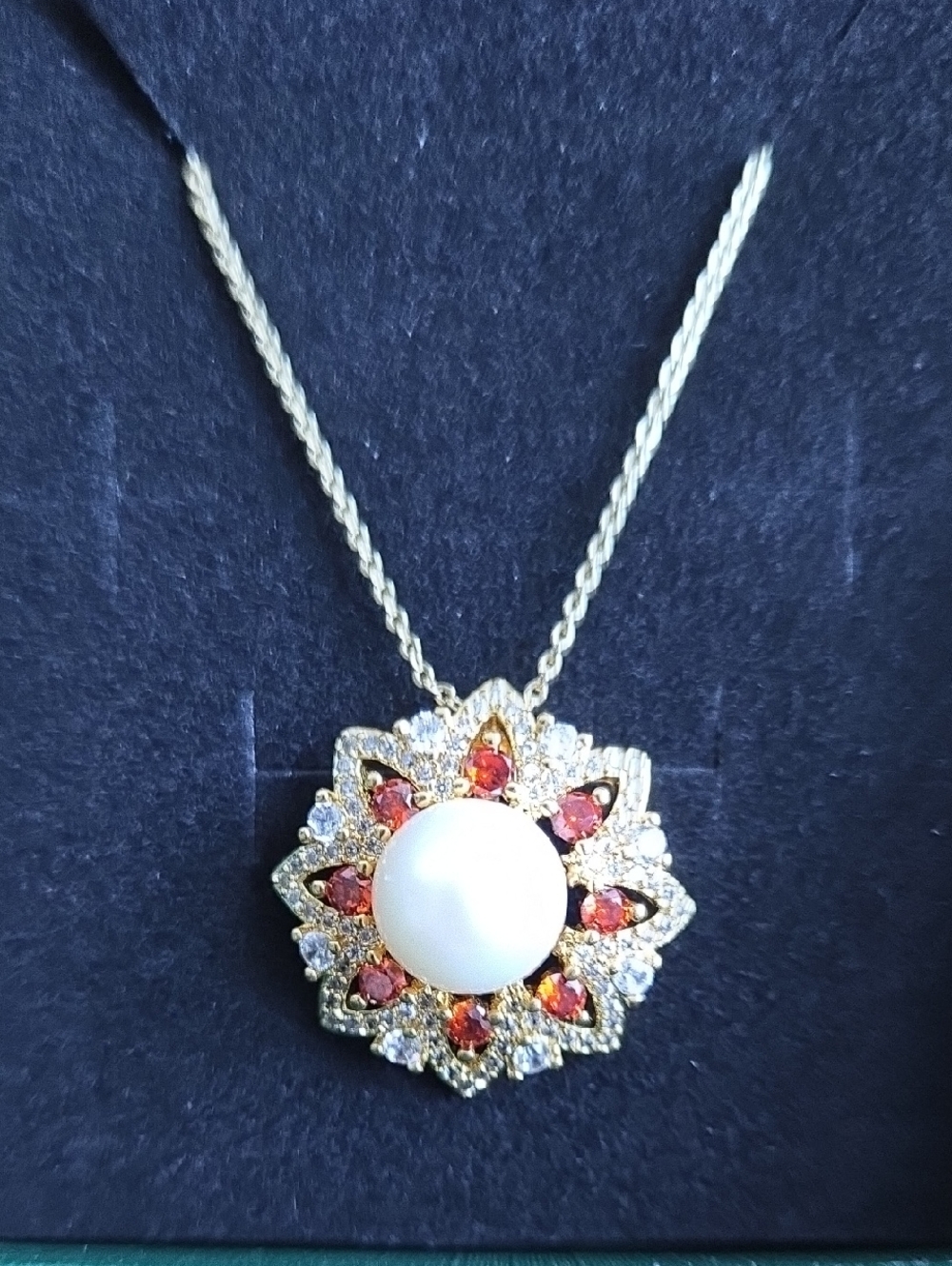 Gold Pearl Sunburst Necklace with Red Gem Accents
